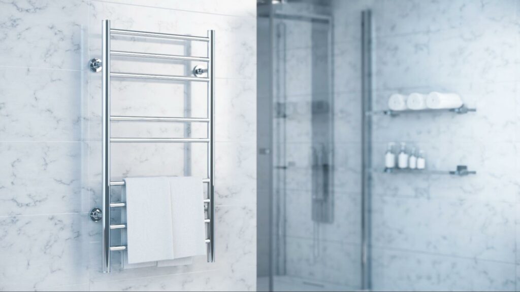 A minimalistic bathroom with a silver wall-mounted heated towel rack.
