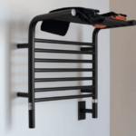 A black wall-mounted heated towel rack with a shelf.